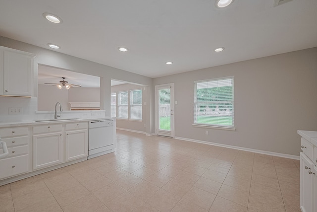 9714 Angleside Ln, Sugar Land, TX 77498 - kitchen with dishwasher, plenty of natural light, light countertops, white cabinets, and recessed lighting