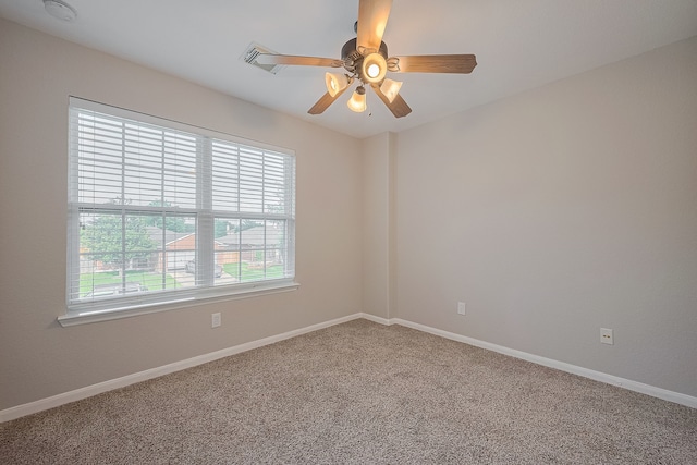 9714 Angleside Ln, Sugar Land, TX 77498 - spare room featuring carpet flooring, a smoke detector, and a ceiling fan