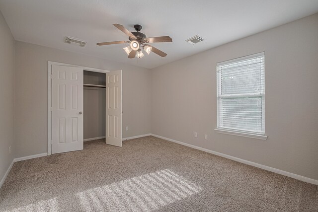 9714 Angleside Ln, Sugar Land, TX 77498 - unfurnished bedroom featuring carpet, a closet, and a ceiling fan