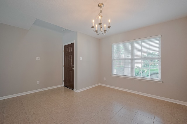 9714 Angleside Ln, Sugar Land, TX 77498 - spare room with a chandelier and baseboards
