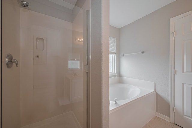 9714 Angleside Ln, Sugar Land, TX 77498 - bathroom with a shower stall, a bath, and tile patterned floors