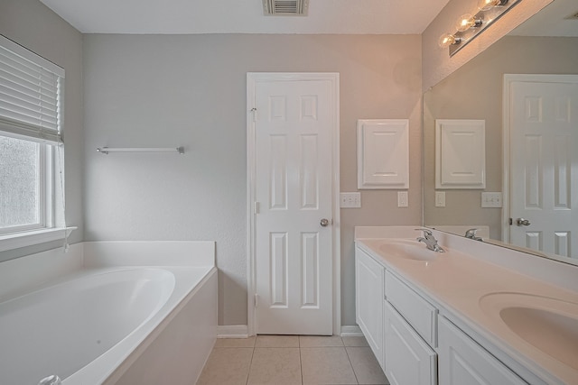 9714 Angleside Ln, Sugar Land, TX 77498 - full bathroom featuring double vanity, tile patterned floors, and a garden tub