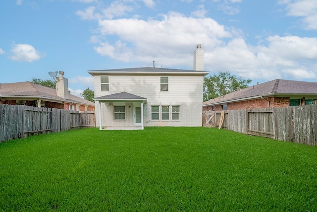 9714 Angleside Ln, Sugar Land, TX 77498 - back of house with a fenced backyard, a patio, a chimney, and brick siding