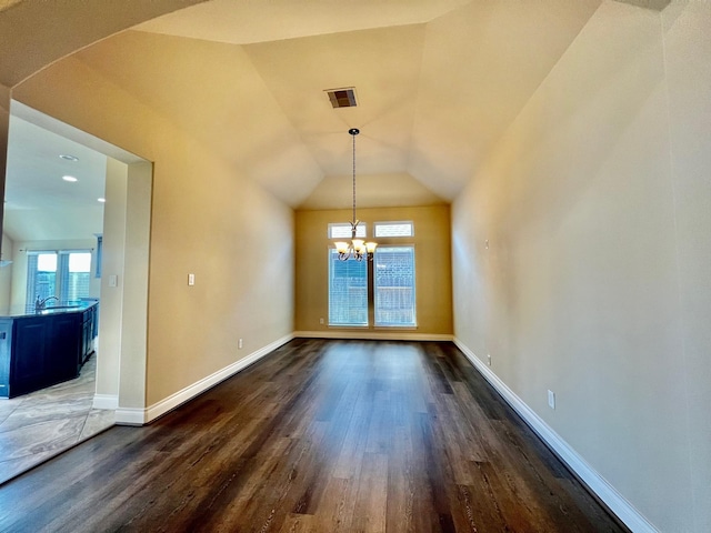 22223 Slate Oaks Ln, Richmond, TX 77469 - unfurnished dining area with dark wood-style flooring, a chandelier, arched walkways, vaulted ceiling, and recessed lighting