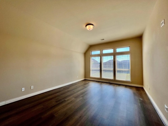 22223 Slate Oaks Ln, Richmond, TX 77469 - spare room featuring dark wood-style floors and vaulted ceiling