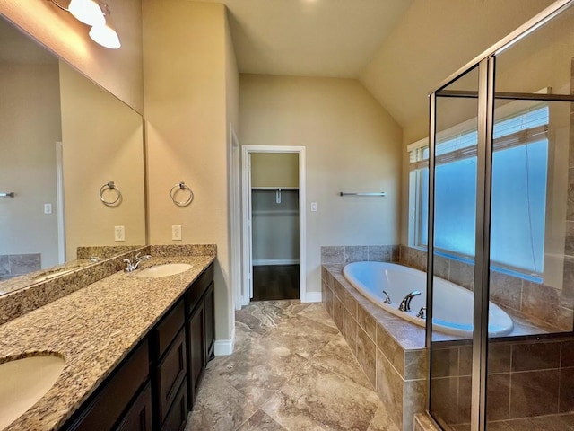 22223 Slate Oaks Ln, Richmond, TX 77469 - bathroom featuring double vanity, a garden tub, a stall shower, lofted ceiling, and a spacious closet