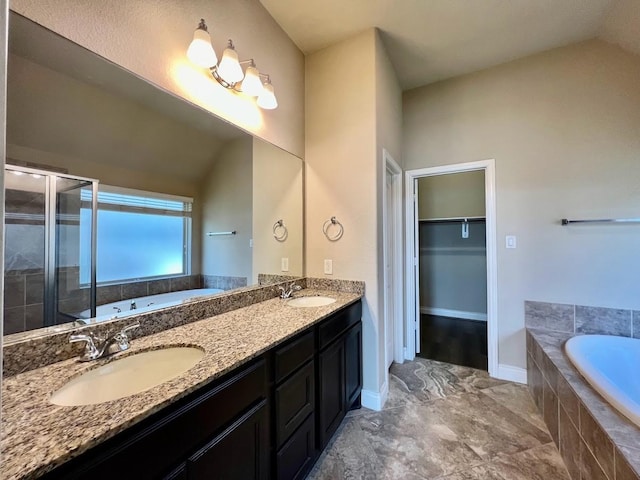 22223 Slate Oaks Ln, Richmond, TX 77469 - bathroom featuring a garden tub, a stall shower, double vanity, and a walk in closet