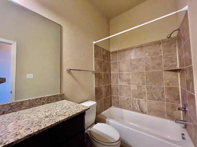 22223 Slate Oaks Ln, Richmond, TX 77469 - bathroom featuring shower / bathtub combination, vanity, and a textured wall
