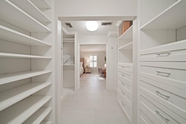 2200 Potomac Dr, Houston, TX 77057 - walk in closet with light tile patterned flooring