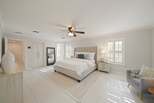 2200 Potomac Dr, Houston, TX 77057 - bedroom featuring ornamental molding, light tile patterned floors, and a ceiling fan