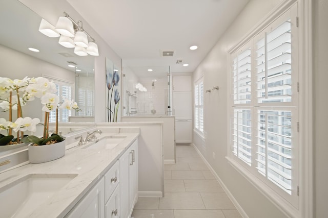 2200 Potomac Dr, Houston, TX 77057 - bathroom with tile patterned flooring, tiled shower, double vanity, and recessed lighting