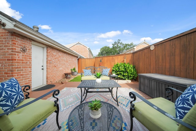 2200 Potomac Dr, Houston, TX 77057 - fenced backyard featuring a deck, an outdoor hangout area, and outdoor dining area