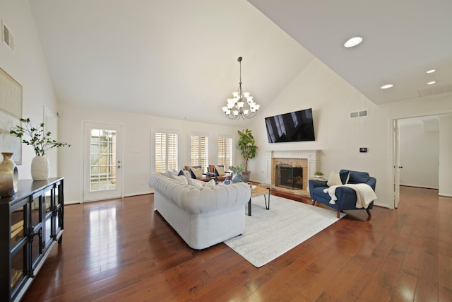 2200 Potomac Dr, Houston, TX 77057 - living area featuring high vaulted ceiling, a fireplace, dark wood-style floors, a chandelier, and recessed lighting