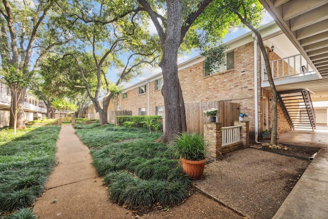 4040 San Felipe St Unit 135, Houston, TX 77027 - view of side of home featuring brick siding and a balcony