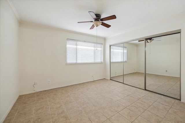 4040 San Felipe St Unit 135, Houston, TX 77027 - unfurnished bedroom featuring crown molding, ceiling fan, light tile patterned flooring, and a closet