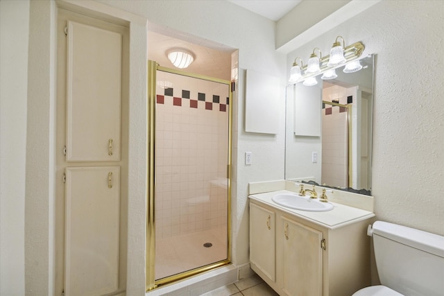 4040 San Felipe St Unit 135, Houston, TX 77027 - bathroom featuring a stall shower, vanity, and tile patterned floors