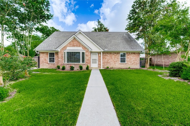 11823 Blair Meadow Dr, Meadows Place, TX 77477 - view of front of property featuring a shingled roof, a fenced backyard, and brick siding