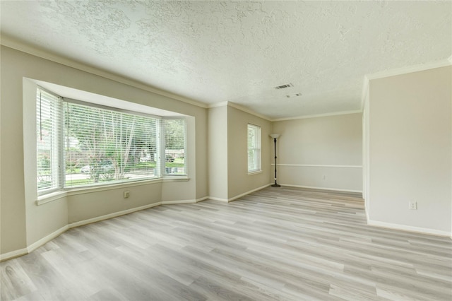 11823 Blair Meadow Dr, Meadows Place, TX 77477 - spare room with a textured ceiling, wood finished floors, and ornamental molding