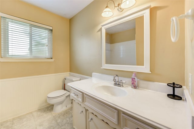 11823 Blair Meadow Dr, Meadows Place, TX 77477 - bathroom featuring a wainscoted wall, vanity, and tile patterned flooring