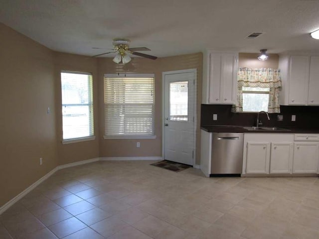70 Lakeside, Trinity, TX 75862 - kitchen with dishwasher, a ceiling fan, dark countertops, and plenty of natural light