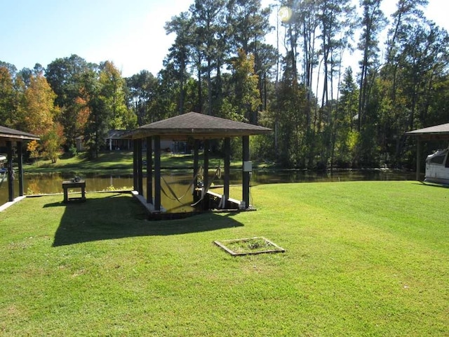 70 Lakeside, Trinity, TX 75862 - view of property's community featuring a gazebo, a water view, and a yard