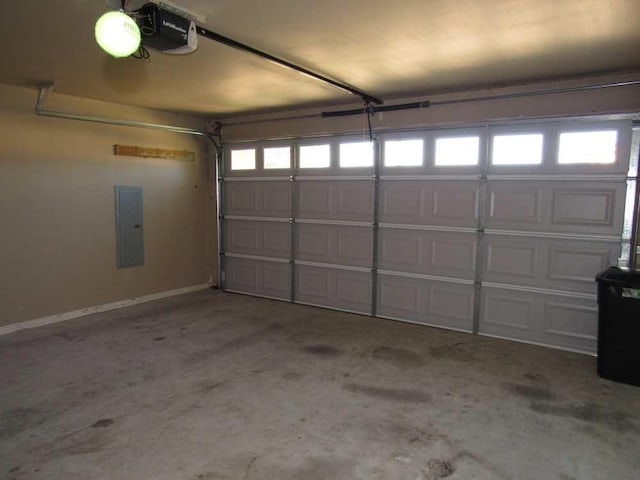 70 Lakeside, Trinity, TX 75862 - garage featuring electric panel and a garage door opener