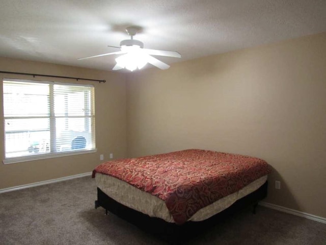 70 Lakeside, Trinity, TX 75862 - carpeted bedroom with baseboards and a ceiling fan