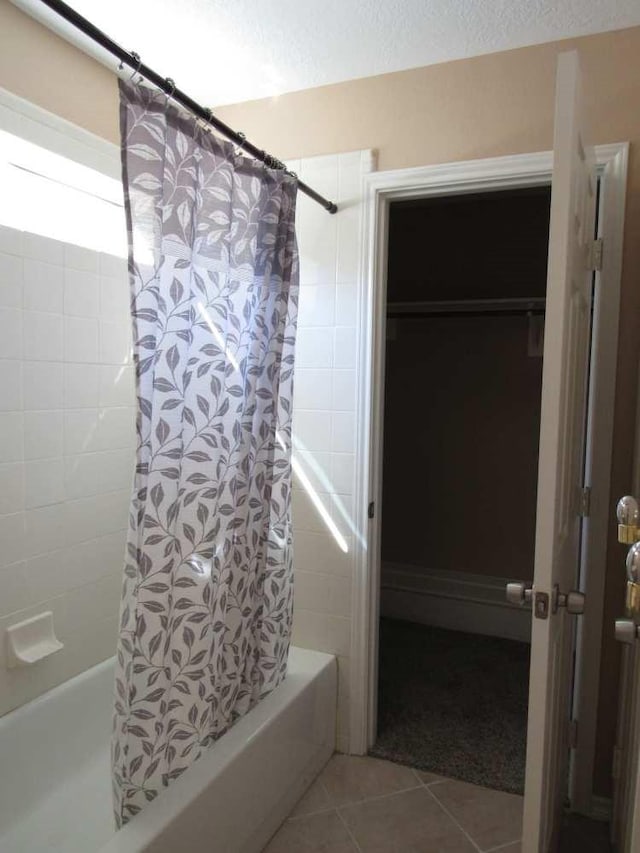 70 Lakeside, Trinity, TX 75862 - full bathroom with shower / tub combo, tile patterned floors, and a textured ceiling