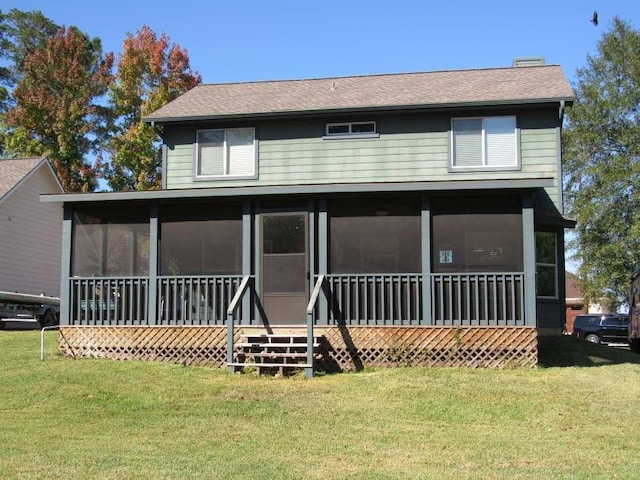 70 Lakeside, Trinity, TX 75862 - back of house featuring a sunroom, a lawn, and roof with shingles
