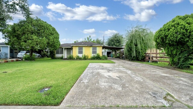 1314 Lawrence Ave, Pasadena, TX 77506 - view of front of house with driveway and a carport