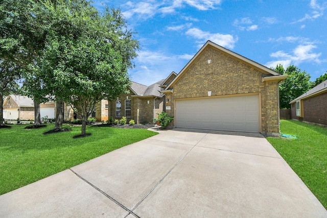30041 Willow Walk Ln, Brookshire, TX 77423 - view of front of house with concrete driveway, brick siding, a garage, and a front lawn
