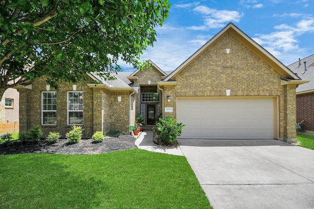 30041 Willow Walk Ln, Brookshire, TX 77423 - view of front facade with a garage, brick siding, concrete driveway, and a front lawn