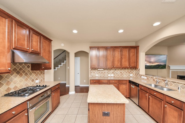 30041 Willow Walk Ln, Brookshire, TX 77423 - kitchen featuring appliances with stainless steel finishes, under cabinet range hood, light tile patterned flooring, decorative backsplash, and recessed lighting