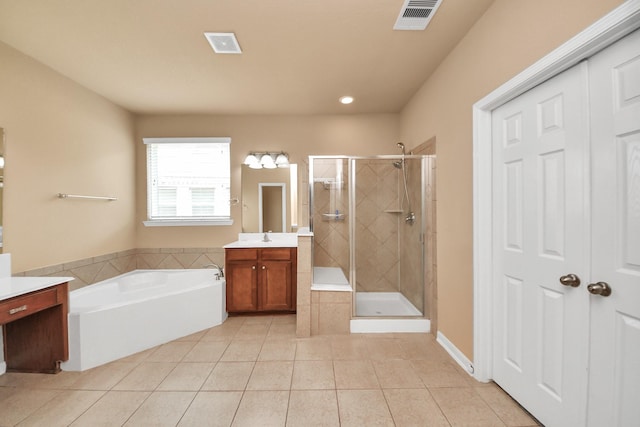 30041 Willow Walk Ln, Brookshire, TX 77423 - full bathroom featuring vanity, tile patterned flooring, a garden tub, a stall shower, and recessed lighting