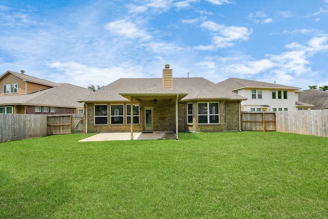 30041 Willow Walk Ln, Brookshire, TX 77423 - back of house with a patio, a fenced backyard, a chimney, brick siding, and roof with shingles