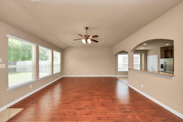 30041 Willow Walk Ln, Brookshire, TX 77423 - unfurnished living room featuring hardwood / wood-style flooring, ceiling fan, arched walkways, and recessed lighting