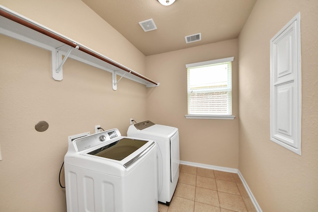 30041 Willow Walk Ln, Brookshire, TX 77423 - laundry area featuring washer and clothes dryer and light tile patterned floors