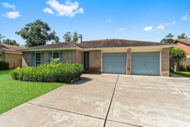3527 Acorn Way Ln, Spring, TX 77389 - ranch-style house with a garage, concrete driveway, brick siding, and a front yard