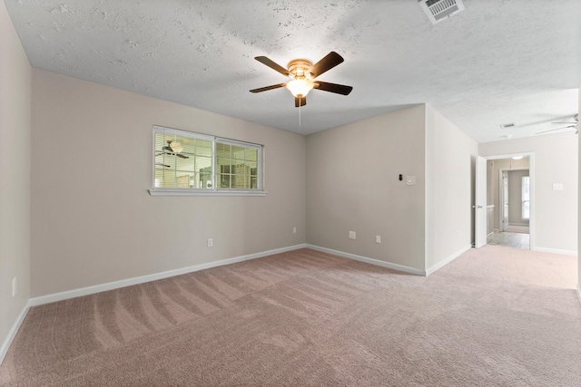 3527 Acorn Way Ln, Spring, TX 77389 - spare room featuring a ceiling fan, light colored carpet, and a textured ceiling