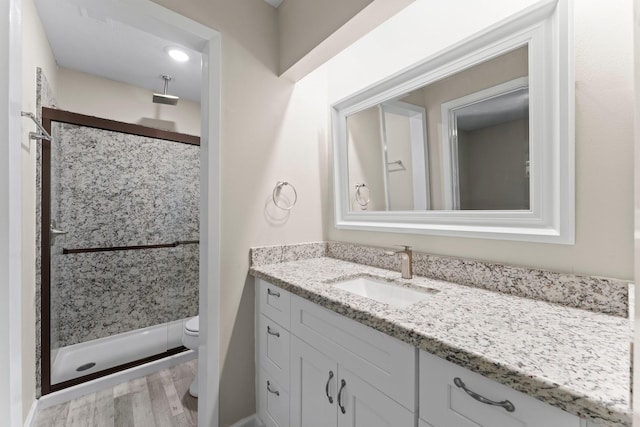 3527 Acorn Way Ln, Spring, TX 77389 - bathroom featuring vanity, a shower stall, and wood finished floors