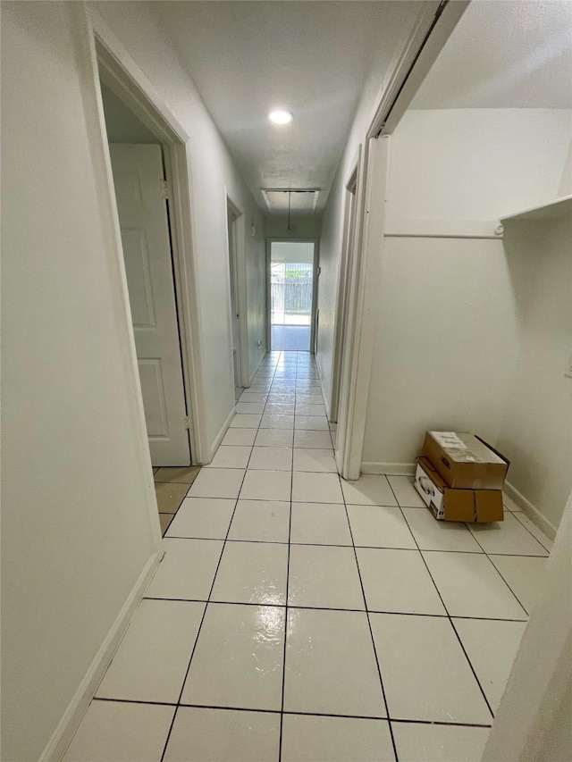 4202 Boone Rd, Houston, TX 77072 - corridor featuring attic access and light tile patterned flooring