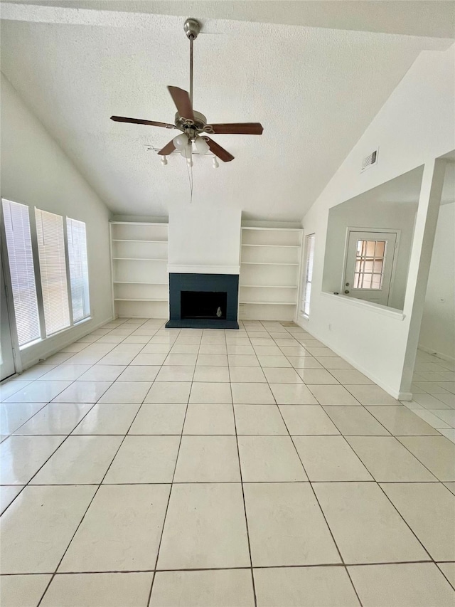 4202 Boone Rd, Houston, TX 77072 - unfurnished living room with vaulted ceiling, a textured ceiling, light tile patterned floors, a ceiling fan, and built in features
