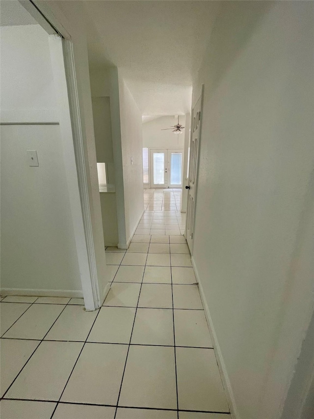 4202 Boone Rd, Houston, TX 77072 - hall featuring light tile patterned floors and baseboards