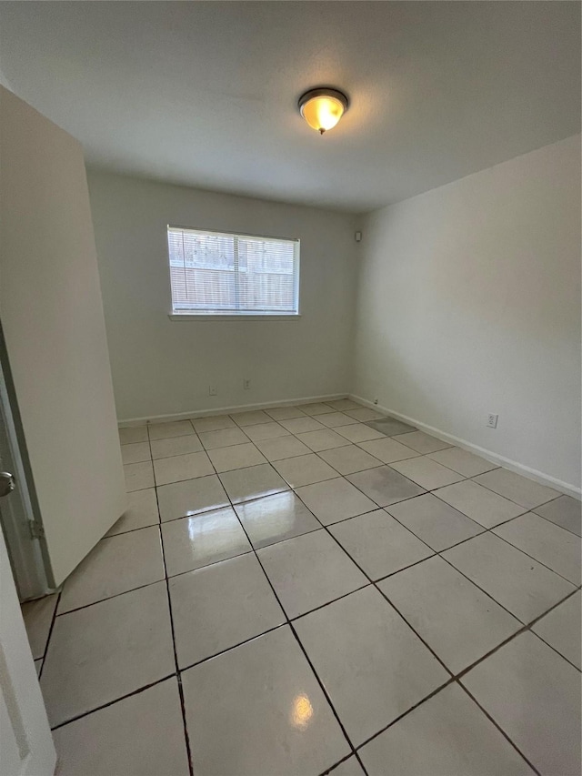 4202 Boone Rd, Houston, TX 77072 - spare room with light tile patterned floors and baseboards