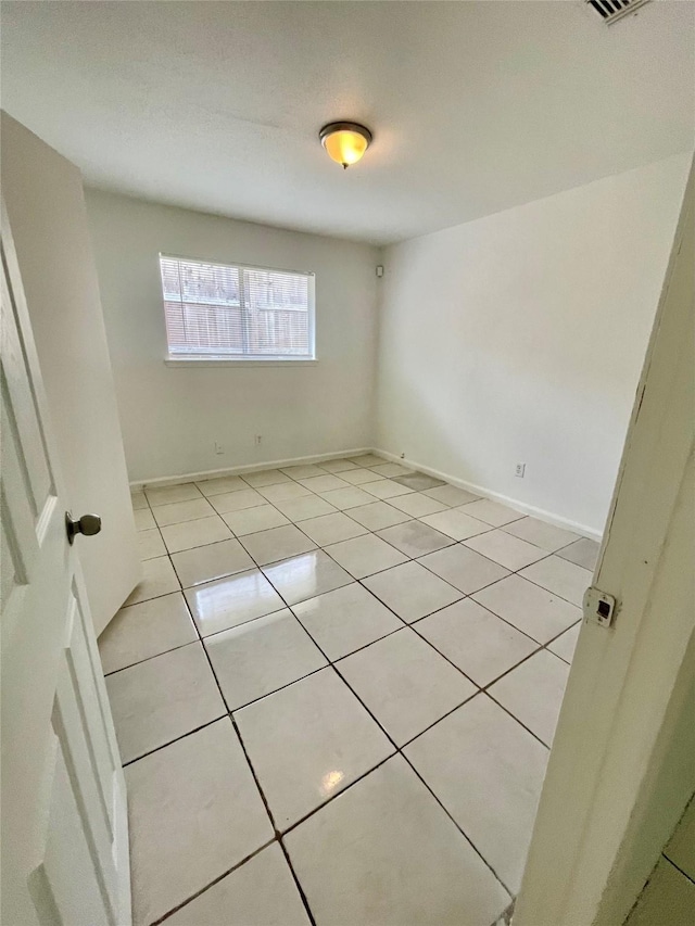 4202 Boone Rd, Houston, TX 77072 - spare room with light tile patterned flooring and baseboards