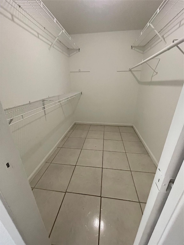 4202 Boone Rd, Houston, TX 77072 - spacious closet featuring tile patterned floors