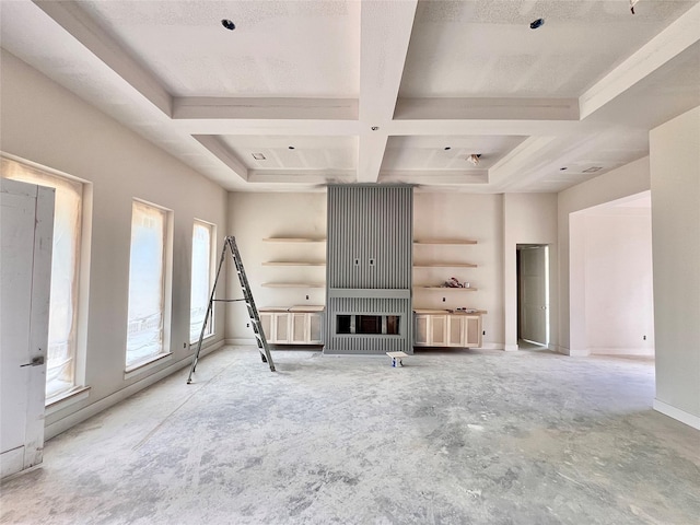 1162 Rd 6604, Dayton, TX 77535 - unfurnished living room featuring coffered ceiling and beam ceiling