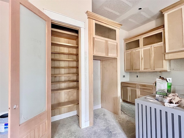 1162 Rd 6604, Dayton, TX 77535 - kitchen featuring unfinished concrete floors and glass insert cabinets