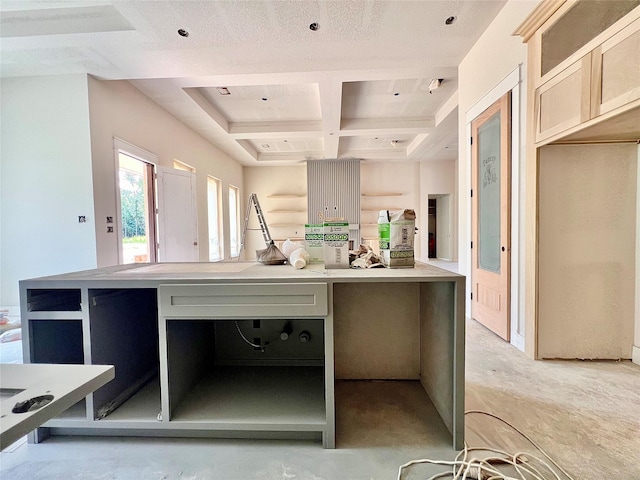 1162 Rd 6604, Dayton, TX 77535 - kitchen featuring coffered ceiling, beamed ceiling, and light countertops