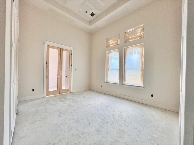 1162 Rd 6604, Dayton, TX 77535 - empty room with unfinished concrete flooring and a raised ceiling